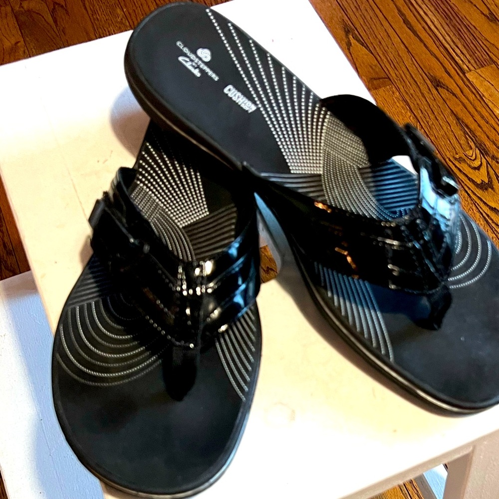 Clark’s black leather sandals